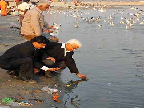 At the confluence of the Ganges water is still red